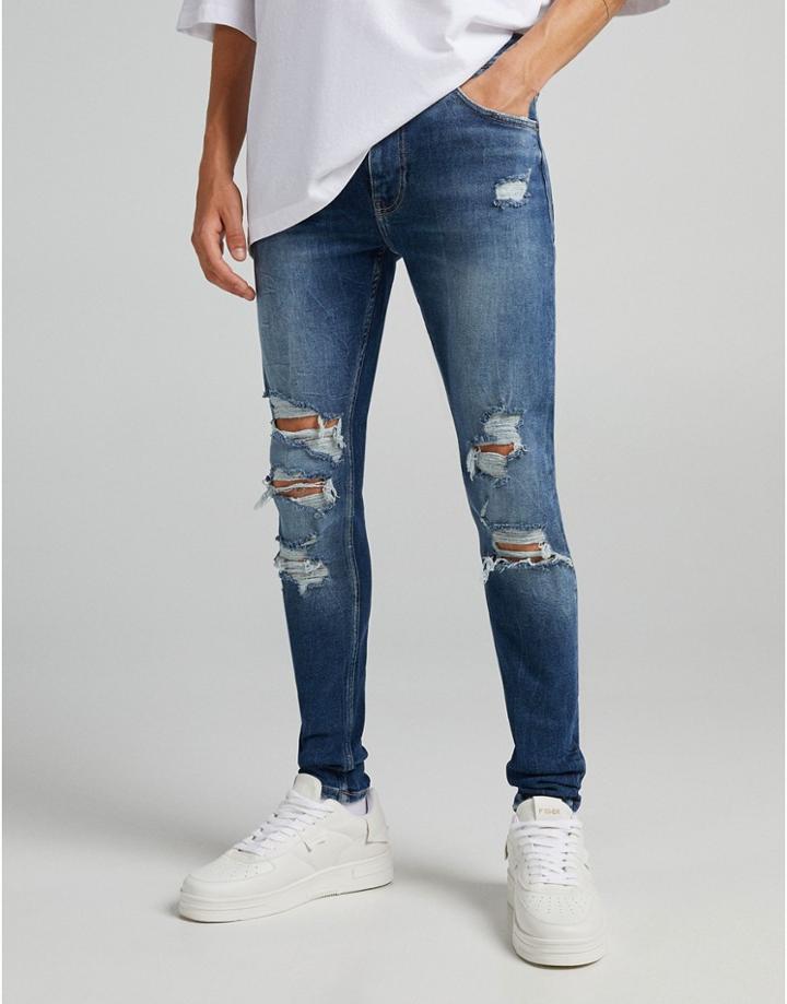Bershka Super Skinny Jeans With Rips And Frayed Hem In Blue-blues