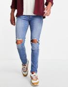 Asos Design Skinny Jeans In Mid Wash With Knee Rips-blues