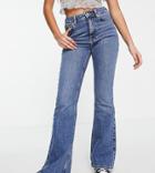 New Look Petite Midrise Flare Jeans In Mid Blue