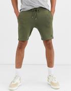 Asos Design Jersey Skinny Shorts In Khaki With Triangle