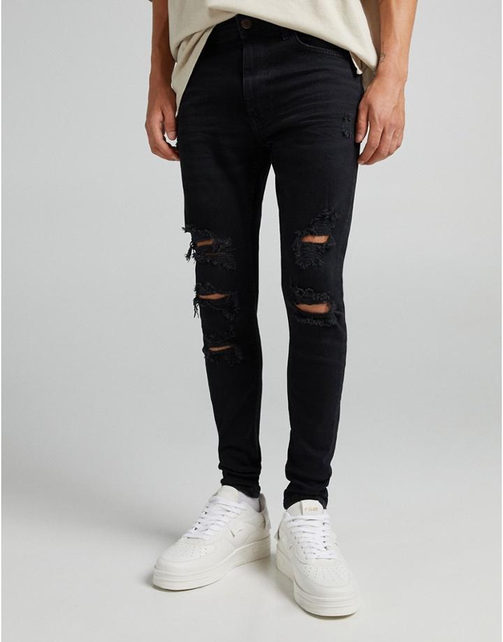 Bershka Super Skinny Jeans With Rips And Frayed Hem In Black