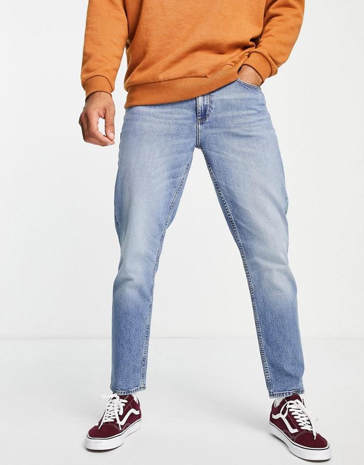 Asos Design Cotton Blend Tapered Jeans In Mid Wash Blue - Mblue-blues