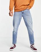 Asos Design Cotton Blend Tapered Jeans In Mid Wash Blue - Mblue-blues