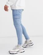 Asos Design Spray On Jeans In Power Stretch With Cargo Pockets In Light Wash Blue