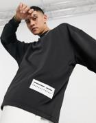 Asos Unrvlld Spply Long Sleeve T-shirt Scuba With Rubberized Patch In Black