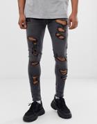 Asos Design Spray On Jeans In Power Stretch With Heavy Rips In Washed Black - Black
