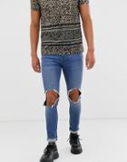 Asos Design Super Skinny Jeans In Mid Wash Blue With Open Knee Rip