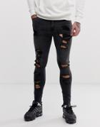 Asos Design Spray On Jeans In Power Stretch With Raw Hem And Heavy Rips In Washed Black