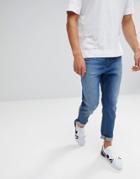 Asos Tapered Jeans In Mid Wash Blue