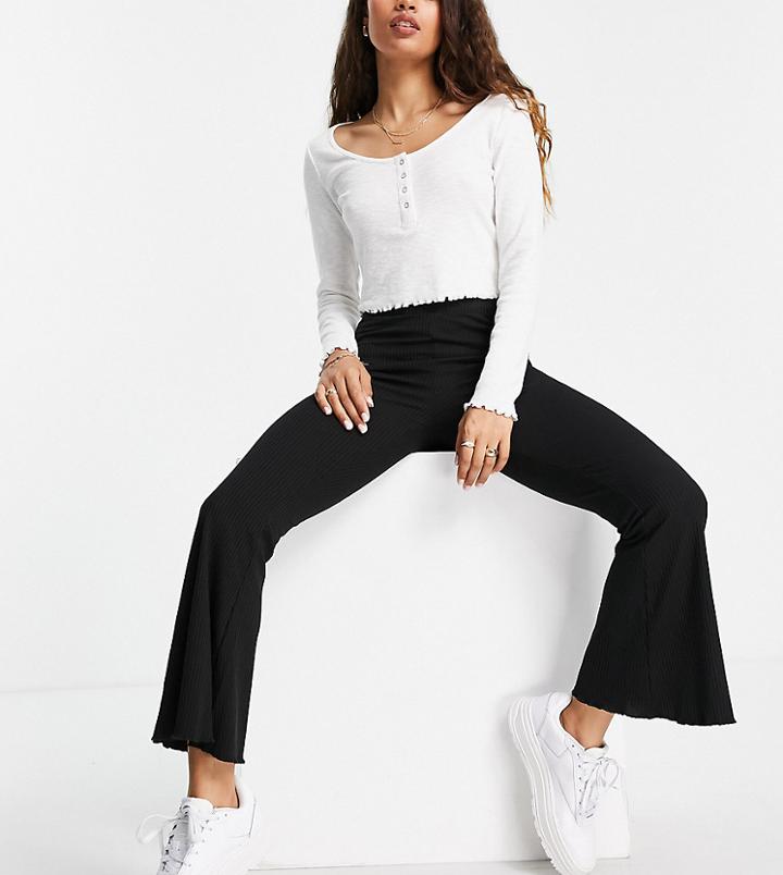 Asos Design Petite Ribbed Flare Pants With Lettuce Hem In Black