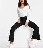 Asos Design Petite Ribbed Flare Pants With Lettuce Hem In Black