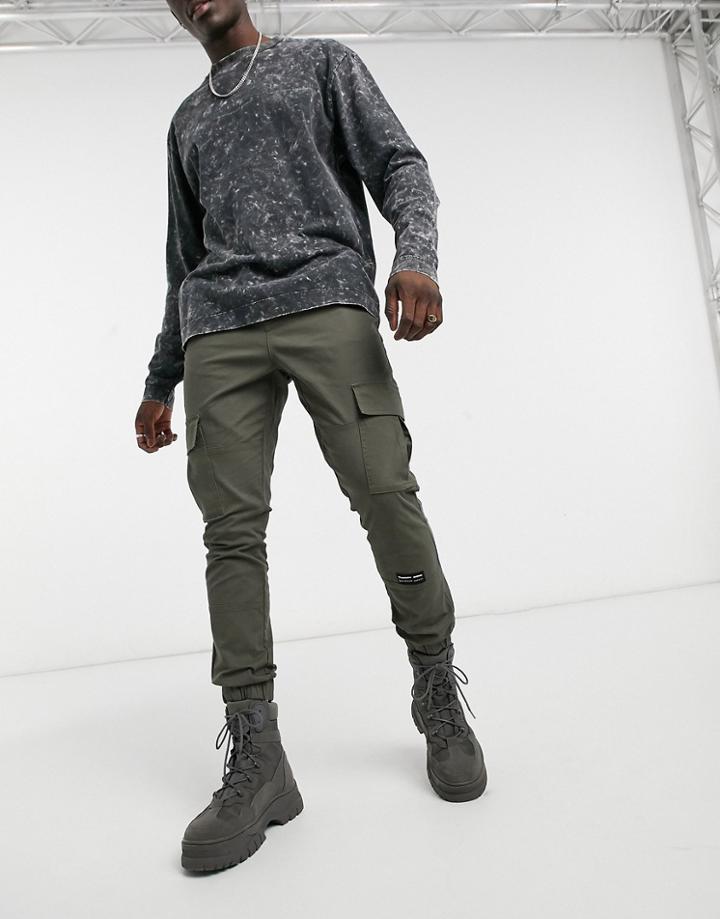 Asos Unrvlld Spply Tapered Cargo Pants In Khaki-green