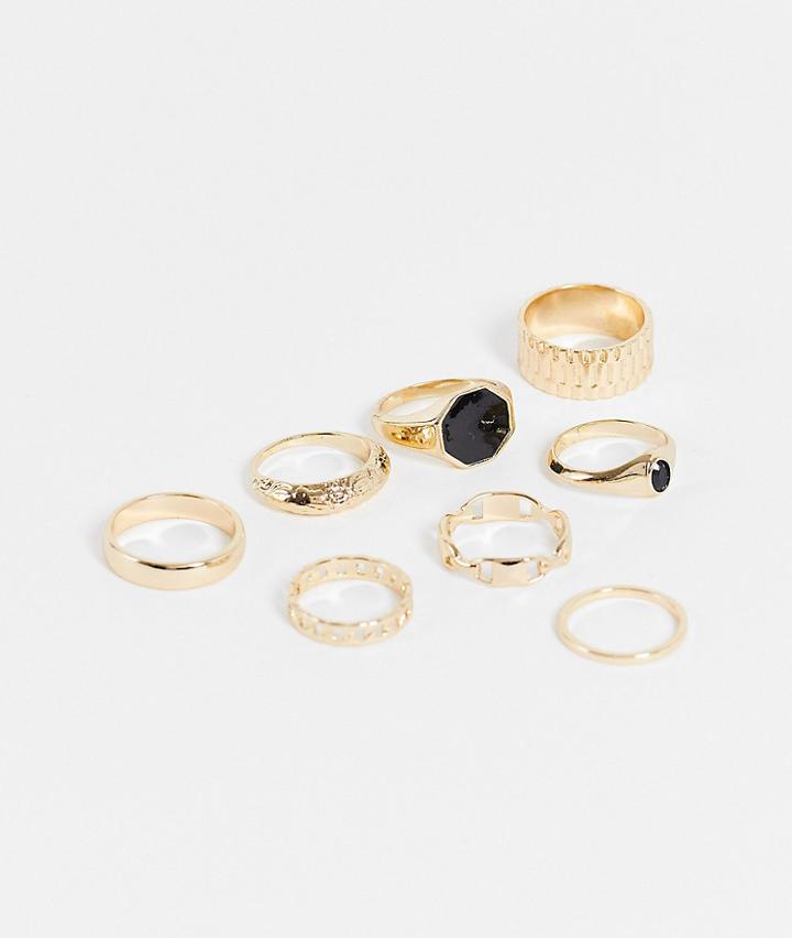 Asos Design 8 Pack Ring Set With Chain And Black Detail In Gold Tone