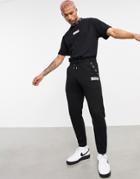 The Couture Club X Ellesse Jordi Logo Sweatpants In Black