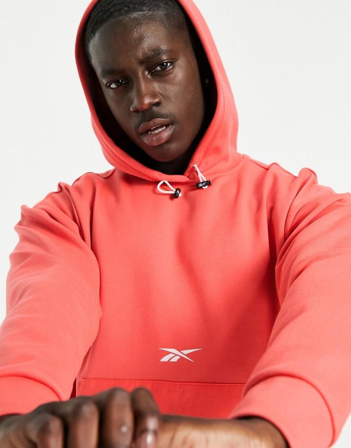 Reebok Training Overhead Hoodie With Woven Pocket In Orange