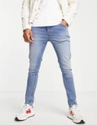 Asos Design Organic Cotton Blend Skinny Jeans In Tinted Light Wash-blues