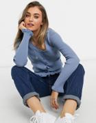 Asos Design Ribbed Cardigan With Ruffle Cuffs And Pocket Detail In Blue
