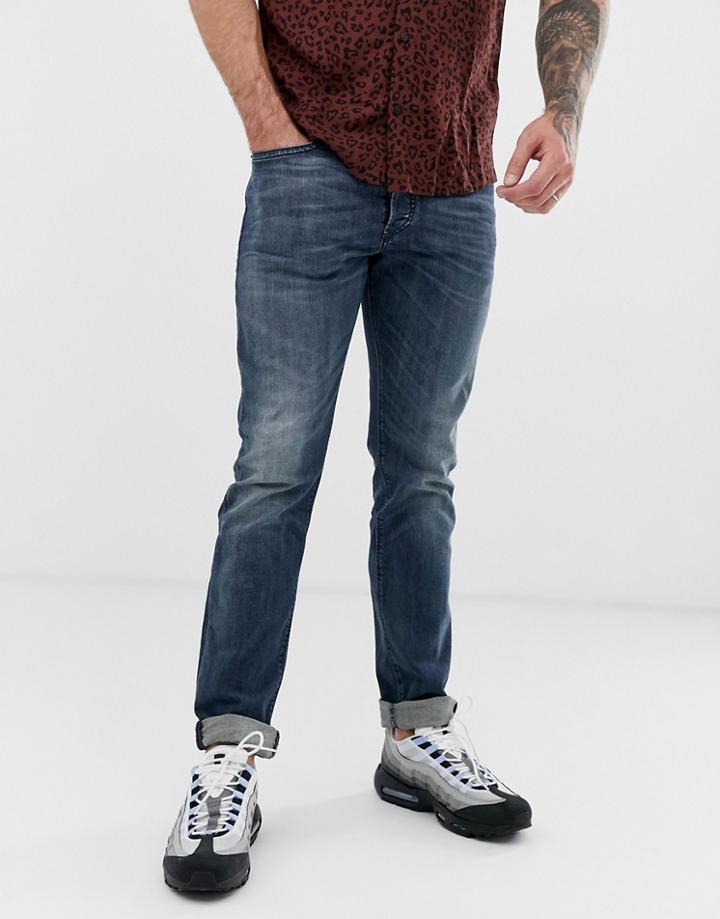 Diesel Buster Regular Slim Tapered Fit Jeans In 084as Mid Wash-blue