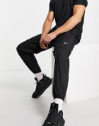Reebok Woven Sweatpants With Small Side Logo In Black