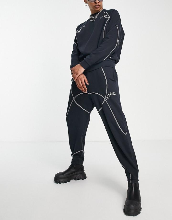 Asos Design Relaxed Sweatpants In Black With Tattoo Print And Stitching Detail - Part Of A Set
