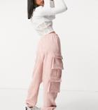 Missguided Textured Cargo Sweatpants With Pocket Detail In Pink