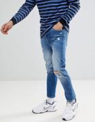 Asos Design Twisted Skinny Jeans In Mid Wash Blue With Rips - Blue