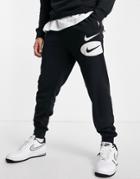 Nike Swoosh Logo Fleece Sweatpants In Black