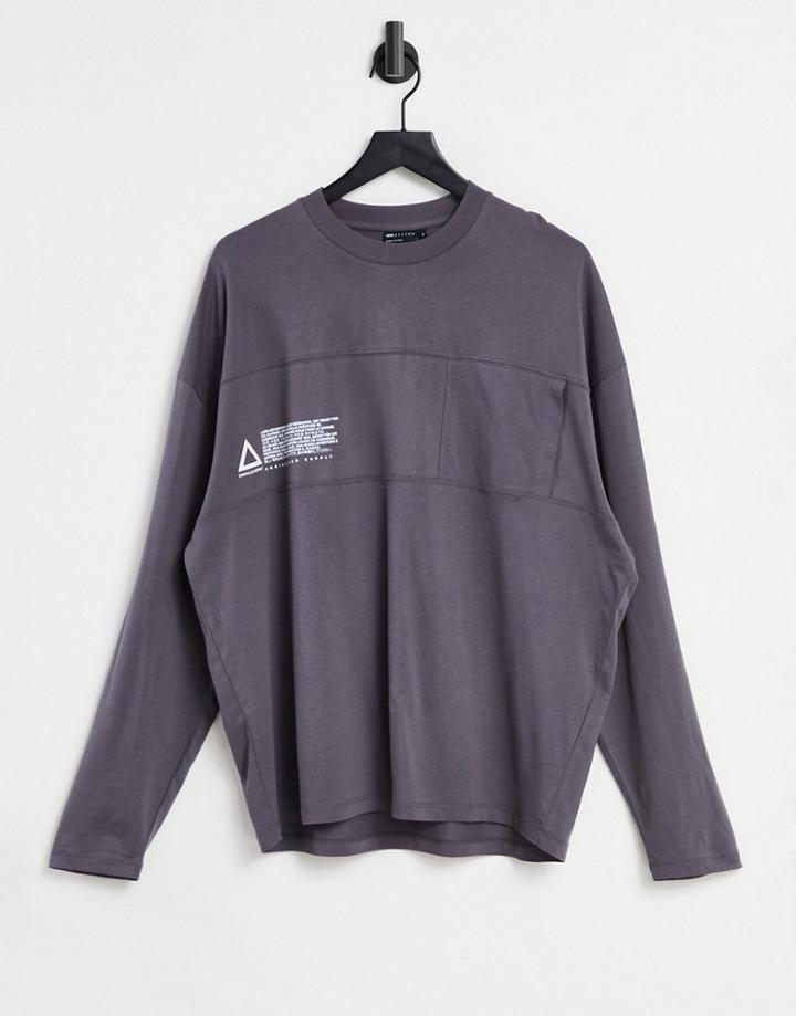 Asos Unrvlld Spply Oversized Long Sleeve T-shirt With Chest Print And Cut And Sew Pocket Detail In Black