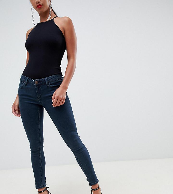 Asos Design Petite Whitby Low Waist Skinny Jeans In Dark Stonewash Blue With Rip And Repair - Blue