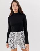 Asos Design Long Sleeve Crop Top With Turtleneck And Raw Hem In Rib In Black