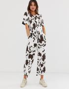 Asos Design Contrast Stitch T-shirt Jumpsuit In Cow Animal Print-multi