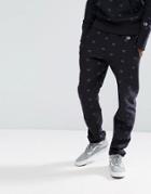 Champion Joggers With All Over Logo Print Exclusive To Asos - Black