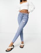 River Island Amelie Ripped Hem Skinny Jeans In Mid Blue-blues