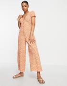 Asos Design Bubble Crepe Cap Sleeve Tea Button Front Jumpsuit In Orange Floral