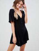Asos Design Swing Romper In Crinkle With Button Detail-black
