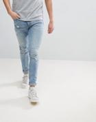 Asos Design Super Skinny Jeans In Light Wash Blue With Abrasions - Blue