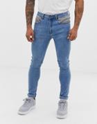 Liquor N Poker Slim Fit Jeans With Heritage Print Pocket Detail In Blue Wash
