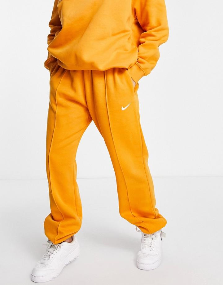 Nike Collection Fleece Loose Fit Cuffed Sweatpants In Mustard-yellow