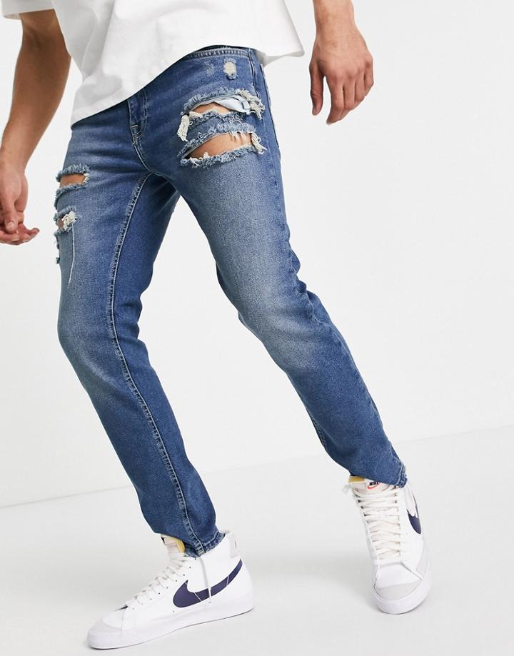 Asos Design Skinny Jeans In Tinted Dark Wash With Heavy Rips-blues