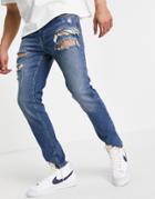 Asos Design Skinny Jeans In Tinted Dark Wash With Heavy Rips-blues