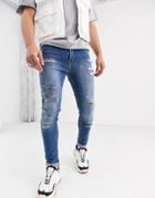 Asos Design Super Skinny Jeans With Heavy Rips In Light Wash Blue