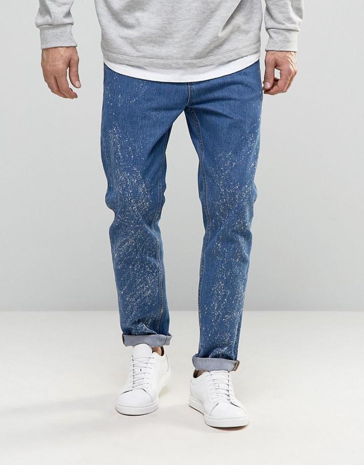 Asos Relaxed Tapered Jeans In Mid Wash With Random Acid - Blue