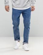 Asos Relaxed Tapered Jeans In Mid Wash With Random Acid - Blue