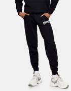 Topshop Oversized Cuffed Sweatpants With Collegiate Courage Leg Graphic In Black-brown