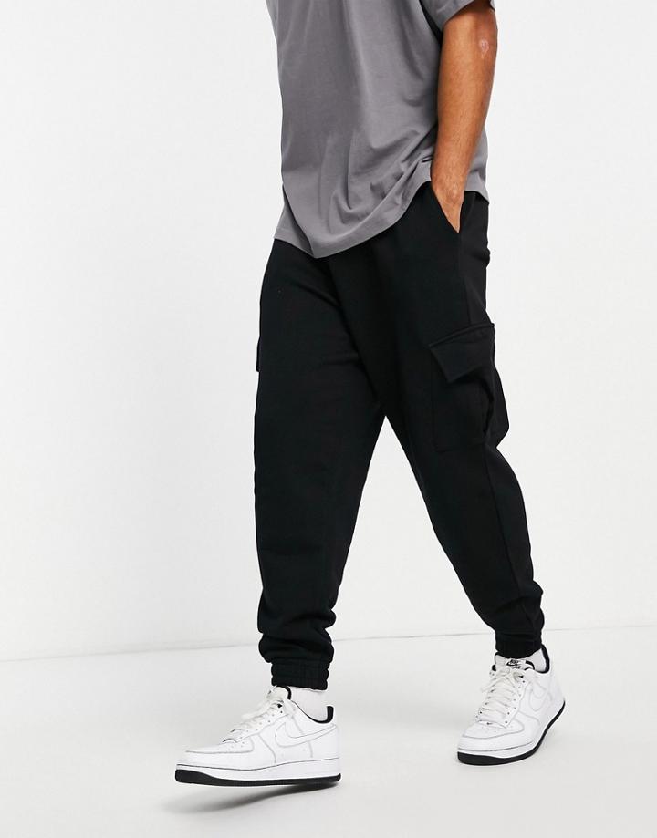Asos Design Oversized Sweatpants With Cargo Pockets In Black
