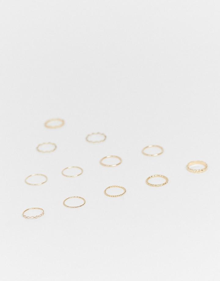 Asos Design Pack Of 12 Rings In Mixed Texture And Twist Designs In Gold Tone