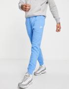 Nike Branded Aop Pack Cuffed Fleece Sweatpants In Blue-blues
