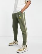 Nike Super Flight Pack Casual Fit Cuffed Fleece Sweatpants In Khaki-green