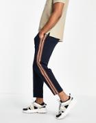 Asos Design Tapered Fixed Hem Joggers With Pin Tucks & Side Tape In Navy