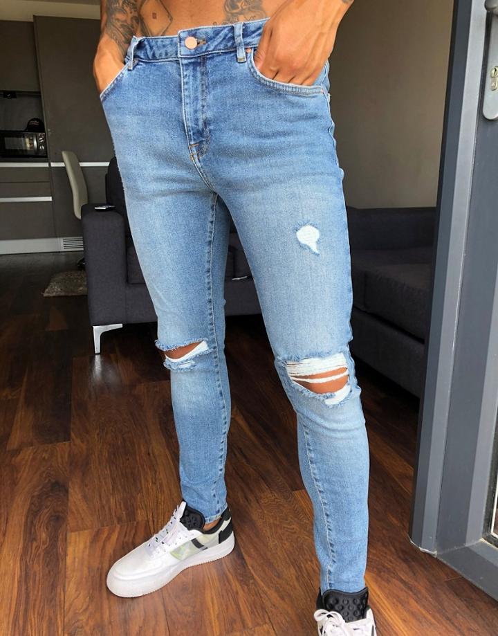 Asos Design Spray On'vintage Look' Jeans With Power Stretch In Mid Wash Blue With Knee Rips-blues